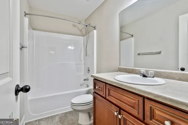 a view of room with window and ceiling fan
