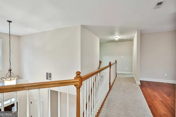 a view of balcony with wooden floor