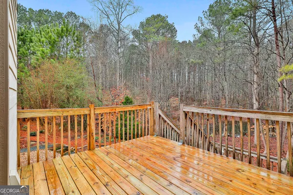 a view of balcony with wooden floor