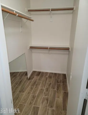 a view of an empty walk in closet