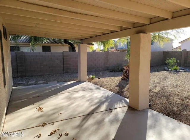 a bedroom with a bed and glass door