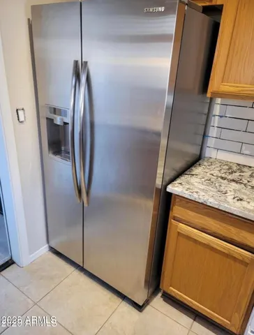a view of a storage and utility room with a sink