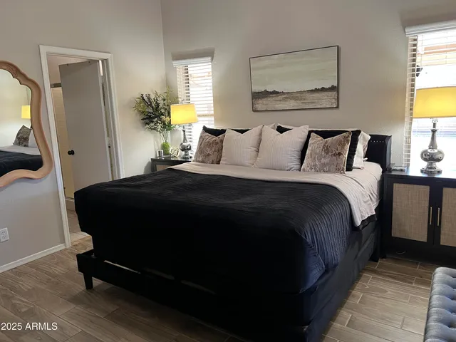 a bedroom with bed and window