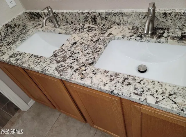a bathroom with a sink and mirror