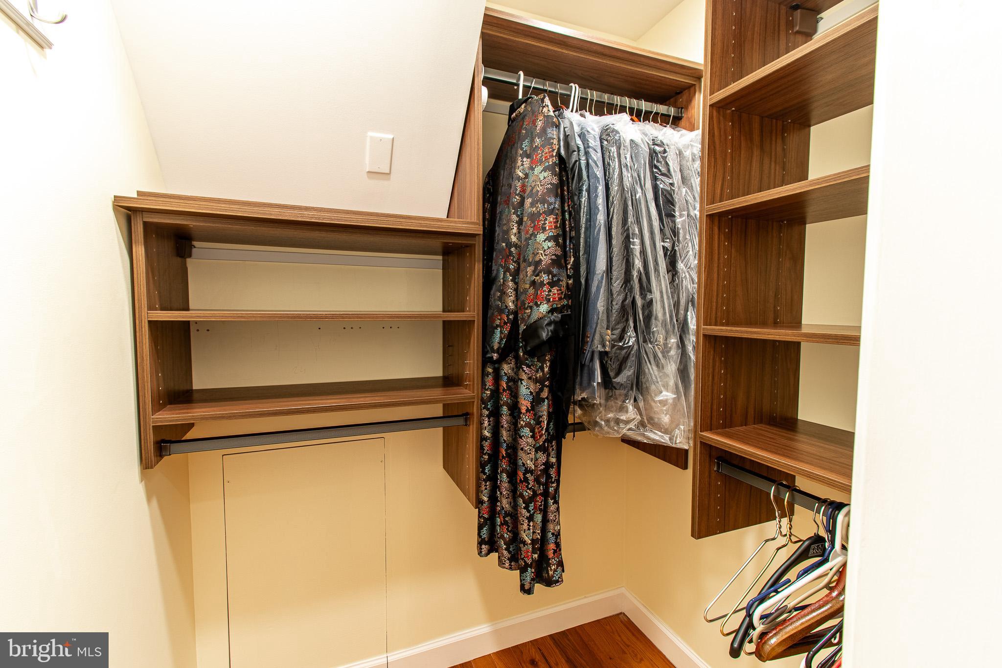 102 Jacks Point Road Oxford, MD 21654 - Photo 53 of 83 a view of walk in closet with clothes and shoes