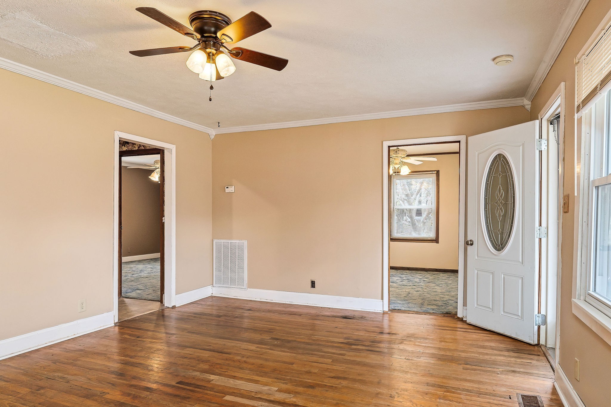 4484 Jefferson Road Smithville, TN 37166 - Photo 4 of 18 a view of a livingroom with a chandelier fan and a hardwood floor