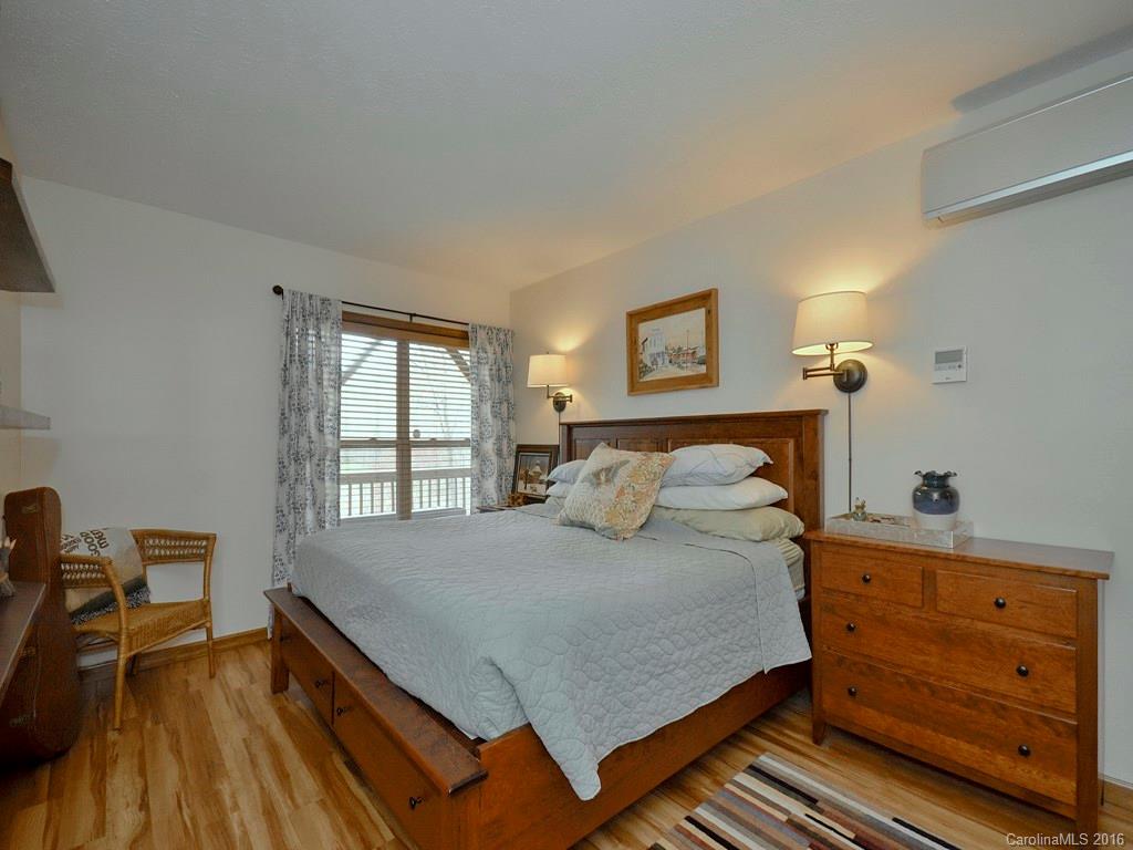 502 Sugar Cove Road Clyde, NC 28721 - Photo 11 of 24 a bedroom with a bed and a window