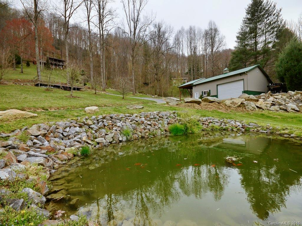 502 Sugar Cove Road Clyde, NC 28721 - Photo 19 of 24 a backyard of a house with a yard and outdoor seating