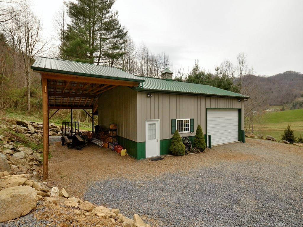 502 Sugar Cove Road Clyde, NC 28721 - Photo 20 of 24 a view of house with outdoor space