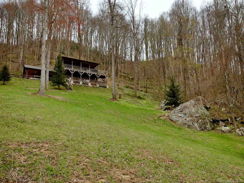 502 Sugar Cove Road Clyde, NC 28721 - Photo 23 of 24 a view of backyard with seating area and green space