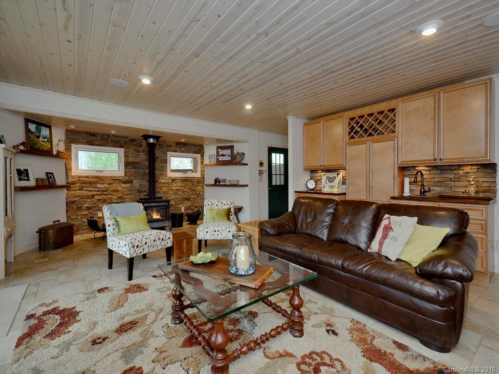 502 Sugar Cove Road Clyde, NC 28721 - Photo 4 of 24 a living room with furniture and a wooden floor