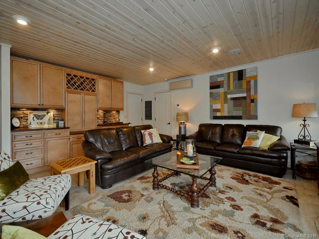 502 Sugar Cove Road Clyde, NC 28721 - Photo 6 of 24 a living room with furniture and a rug