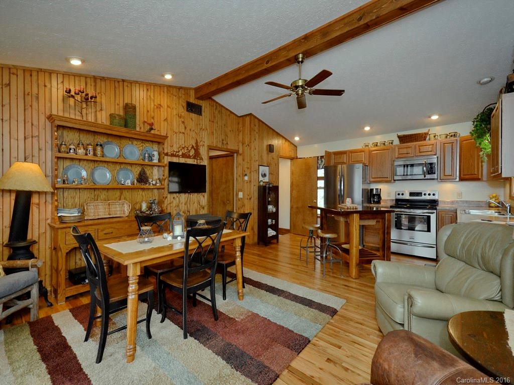 502 Sugar Cove Road Clyde, NC 28721 - Photo 9 of 24 a view of a dining room with furniture