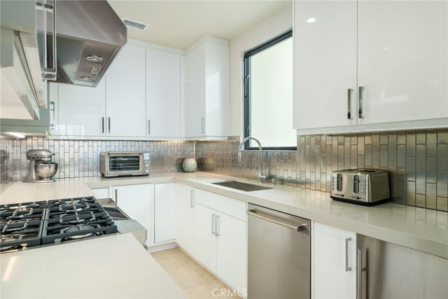 a living room with furniture and a painting