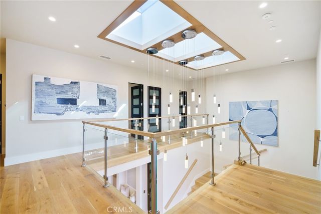 a bedroom with a large bed and a large window