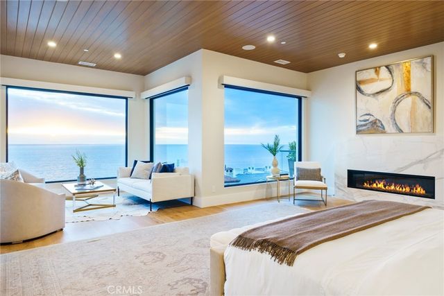 a view of a terrace with couches and lounge chairs