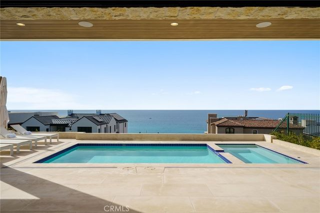 a living room with furniture a rug and a large window