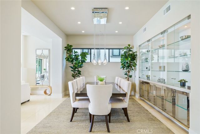 a kitchen with stainless steel appliances a sink a stove a microwave and cabinets