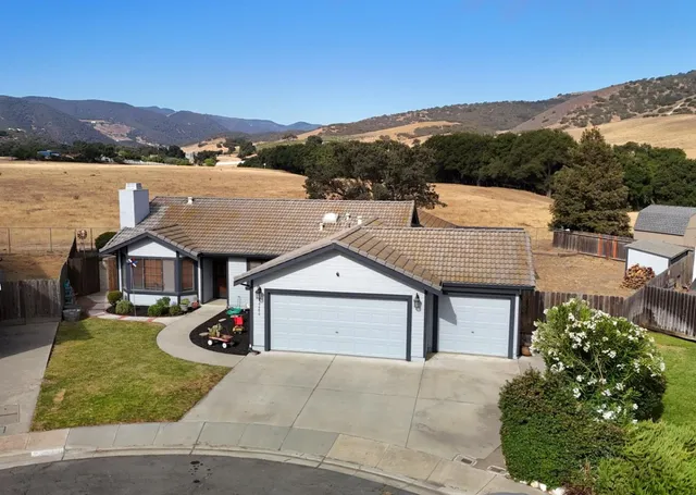 a view of a house with a yard and balcony