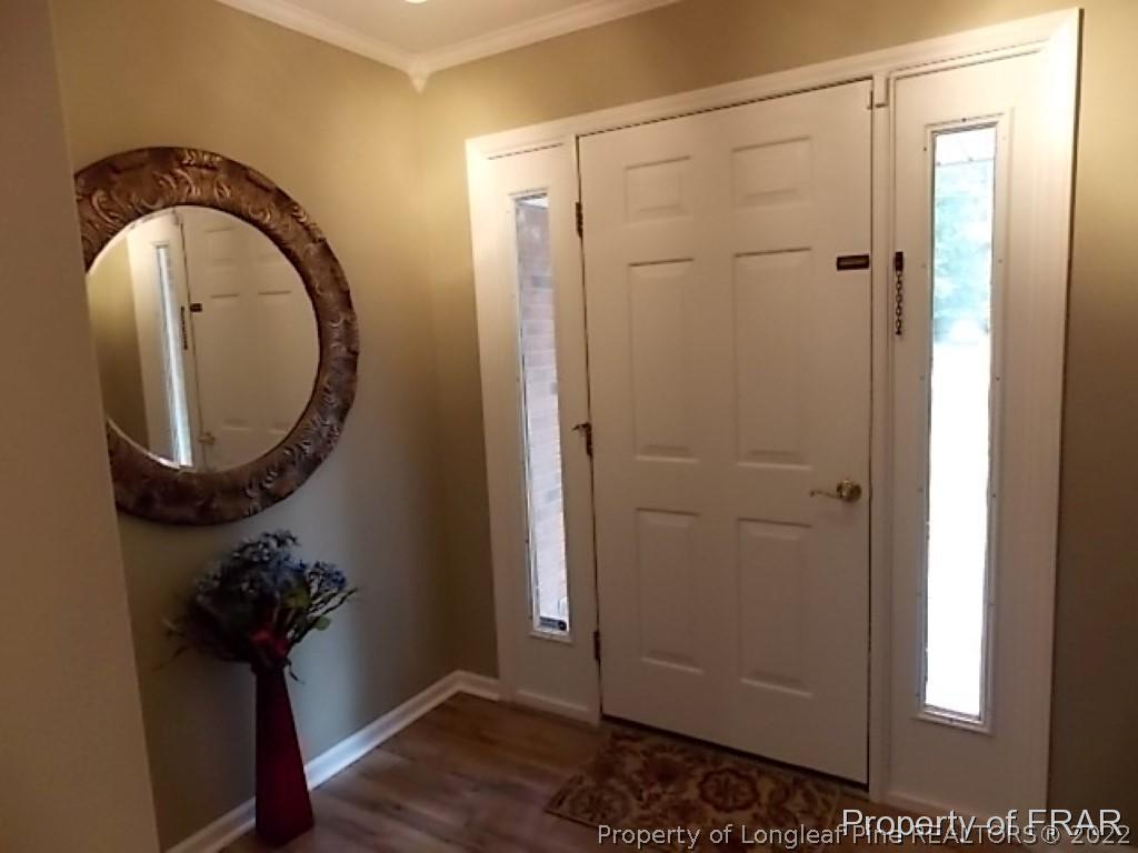 530 Hill Road Southern Pines, NC 28387 - Photo 3 of 25 a view of a bathroom with a toilet and a mirror