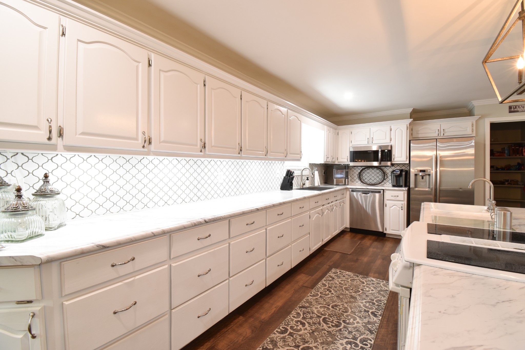 1000 Five Points Road Pulaski, TN 38478 - Photo 27 of 50 a kitchen with granite countertop a sink stainless steel appliances and cabinets