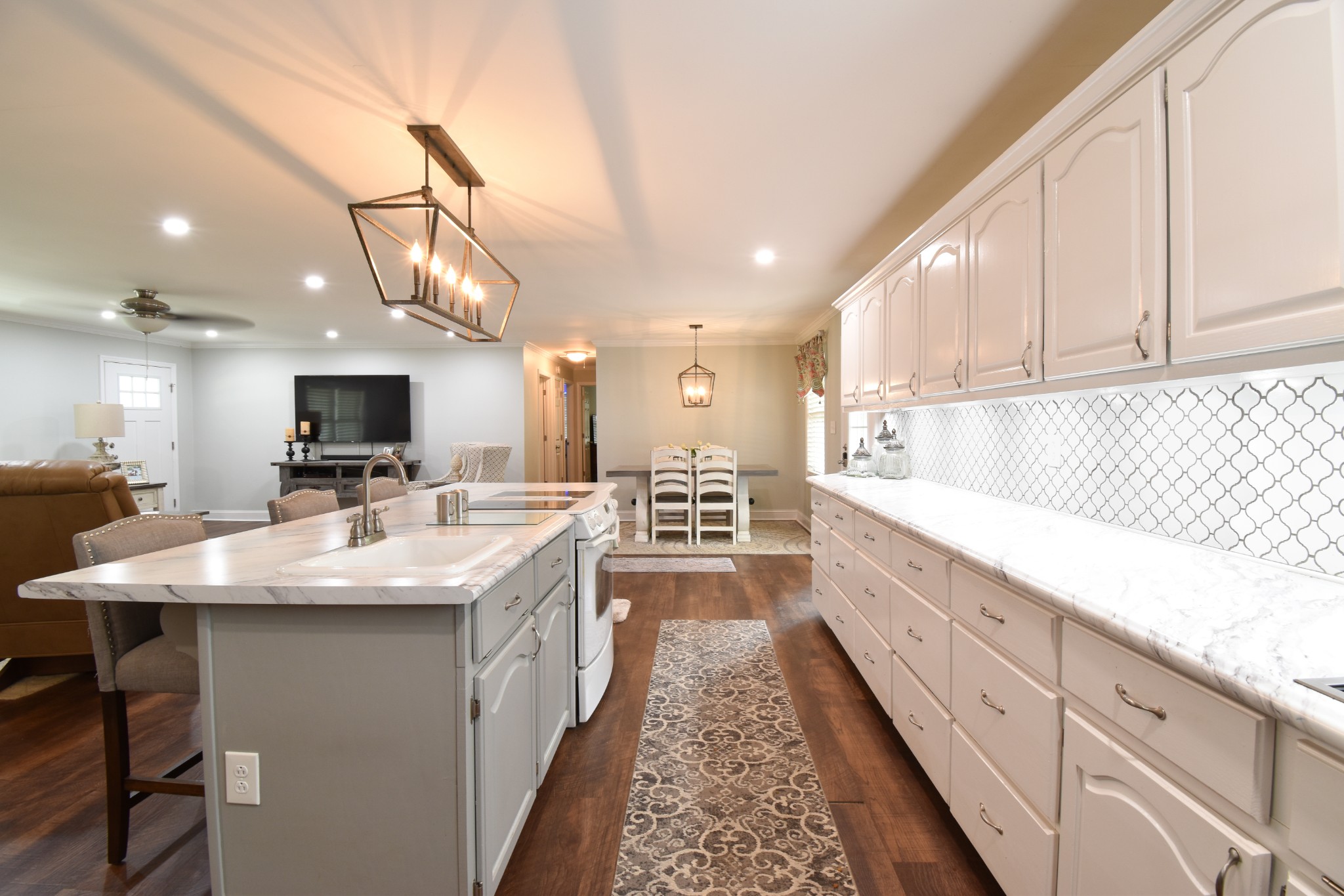 1000 Five Points Road Pulaski, TN 38478 - Photo 30 of 50 a large kitchen with stainless steel appliances kitchen island granite countertop a sink and cabinets