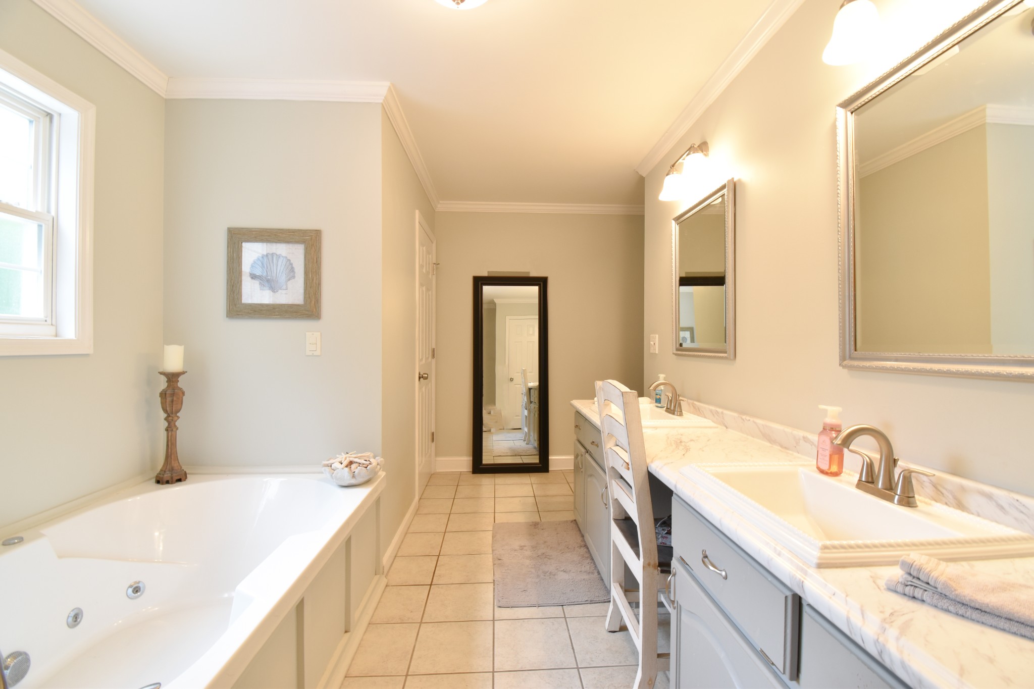 1000 Five Points Road Pulaski, TN 38478 - Photo 37 of 50 a spacious bathroom with a tub sink and mirror