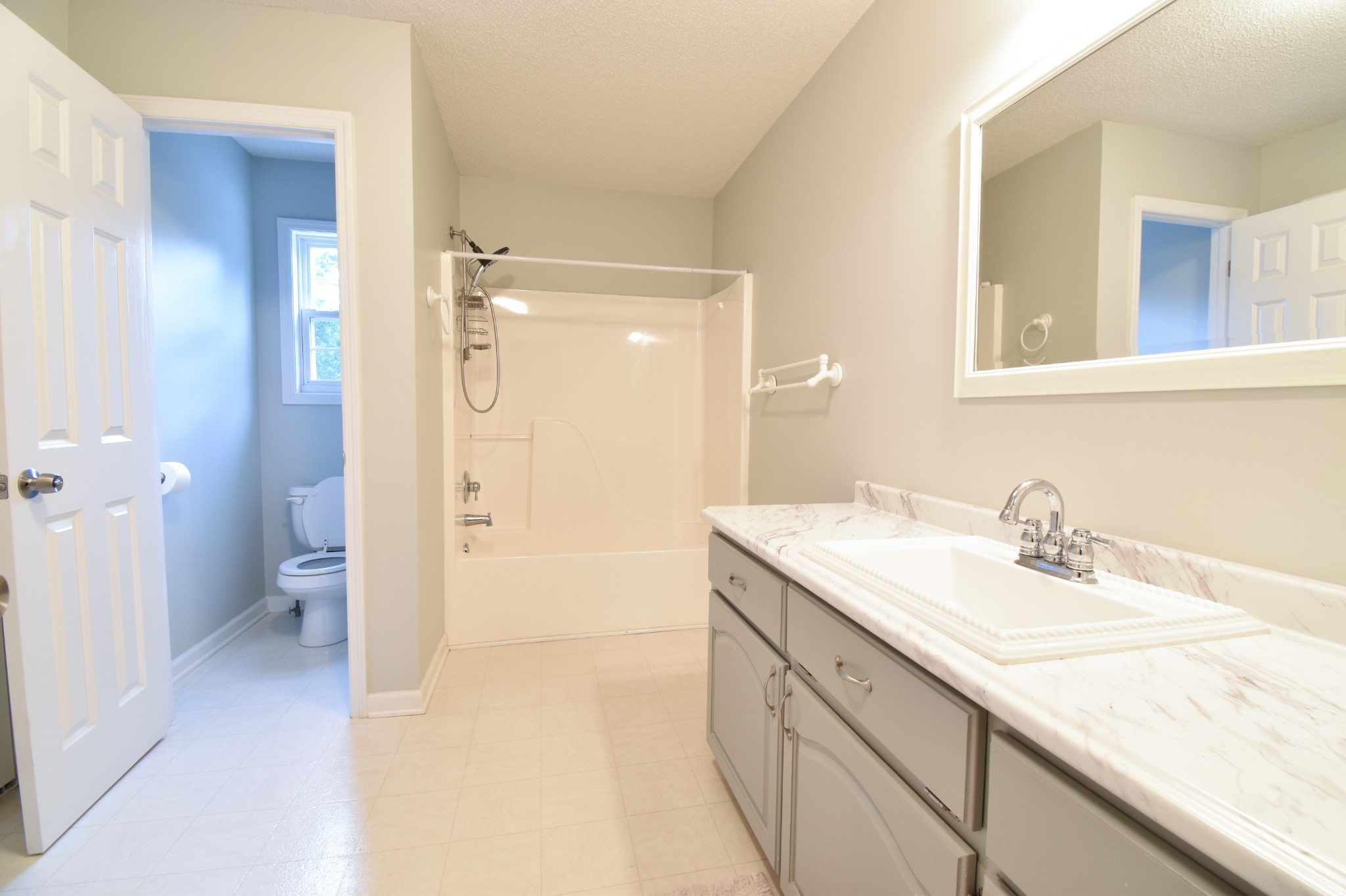 1000 Five Points Road Pulaski, TN 38478 - Photo 6 of 50 a spacious bathroom with a granite countertop sink mirror and a toilet