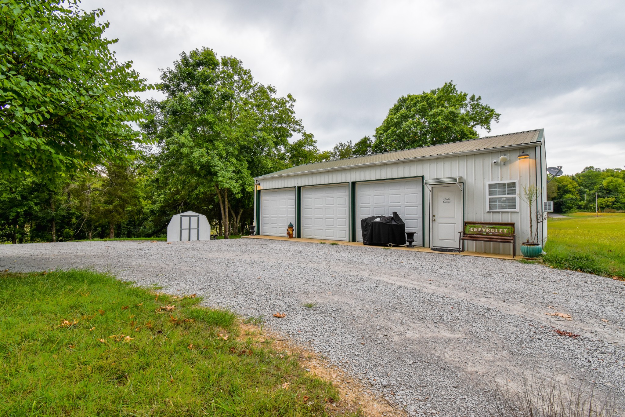1000 Five Points Road Pulaski, TN 38478 - Photo 10 of 50 a front view of a house with a yard and a garage