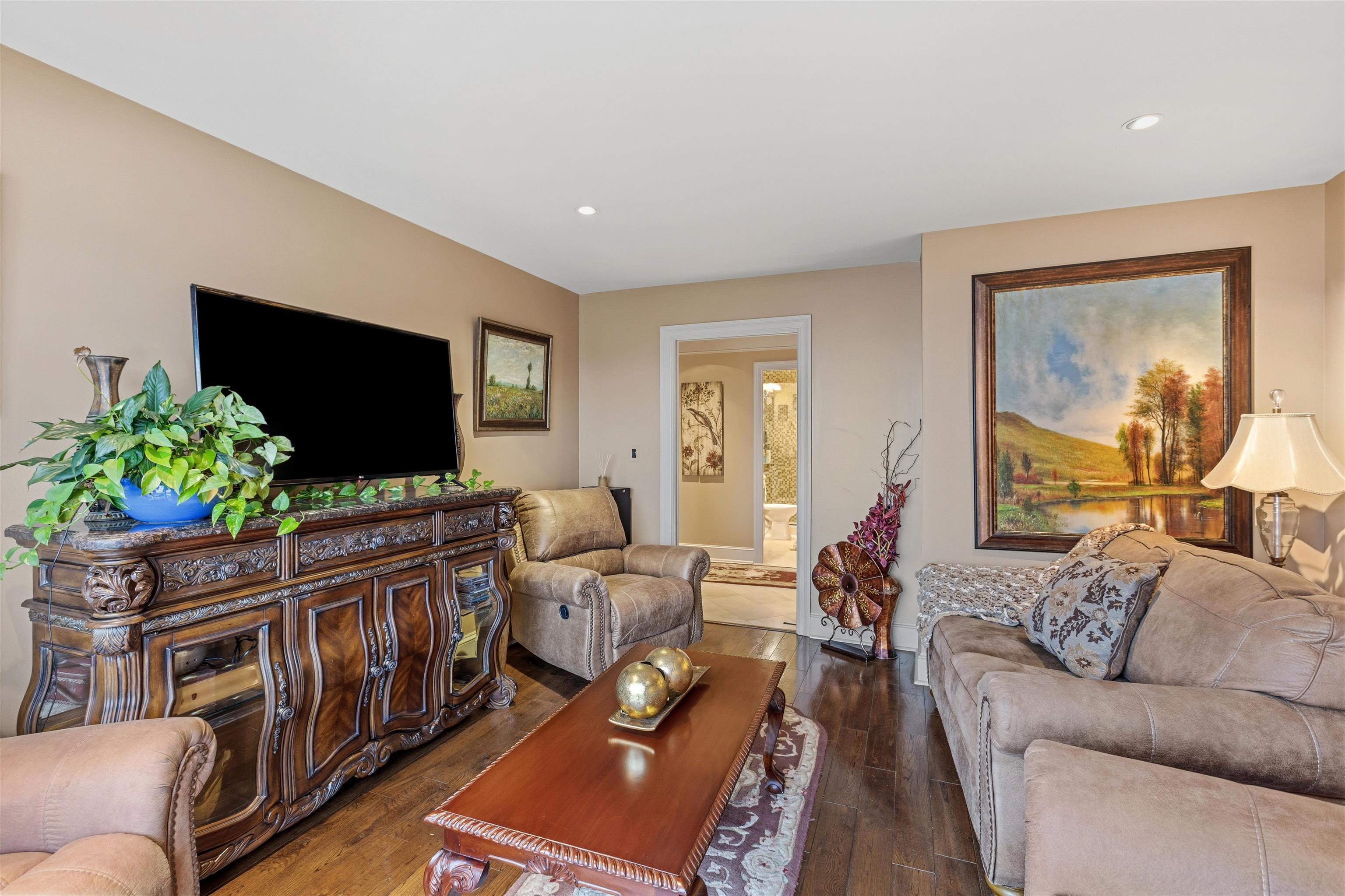 655 Riverside Drive, Unit 1208 Memphis, TN 38103 - Photo 16 of 29 Living area with dark wood-style flooring and recessed lighting