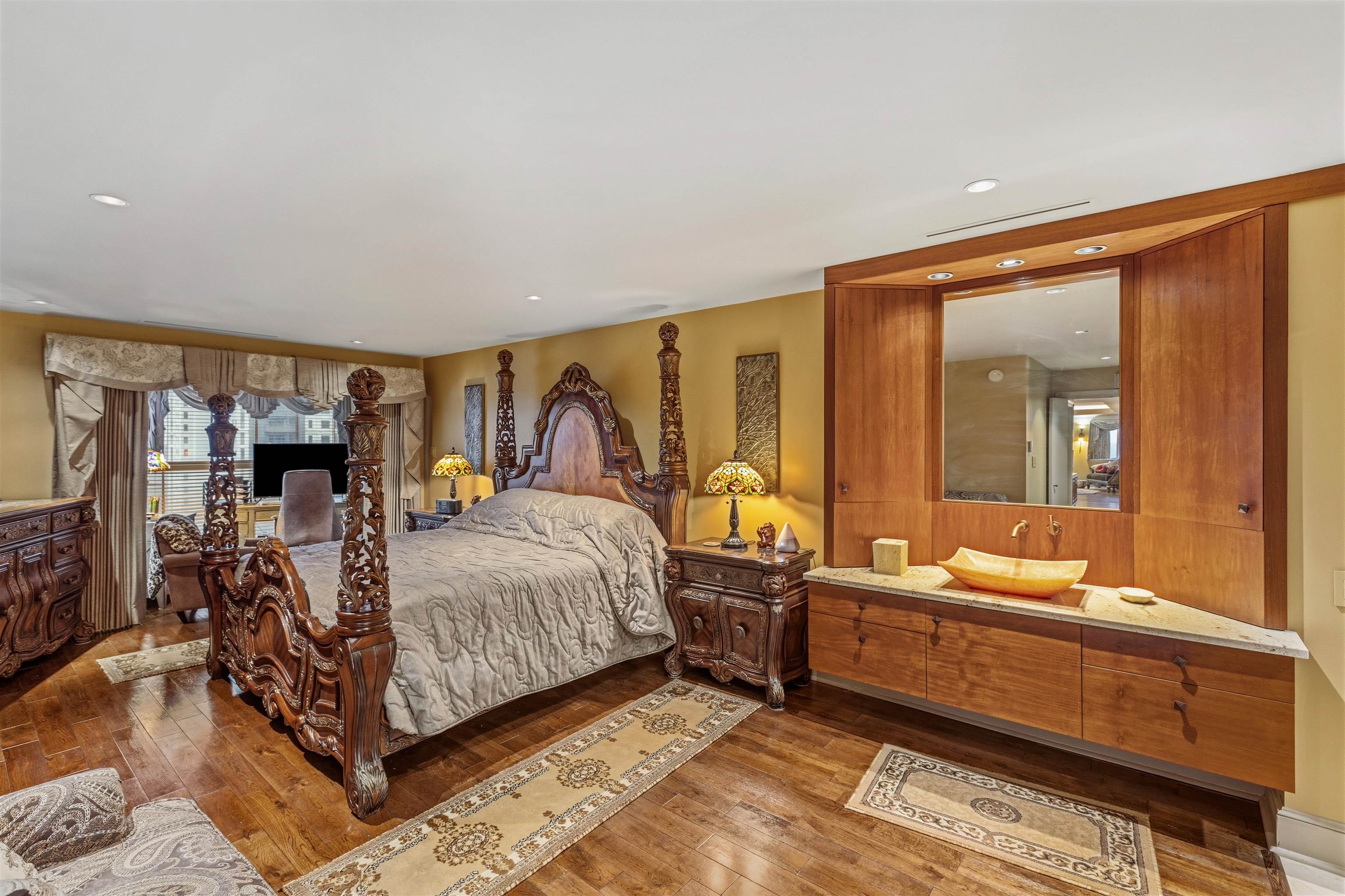 655 Riverside Drive, Unit 1208 Memphis, TN 38103 - Photo 17 of 29 Bedroom featuring dark wood-style floors and recessed lighting