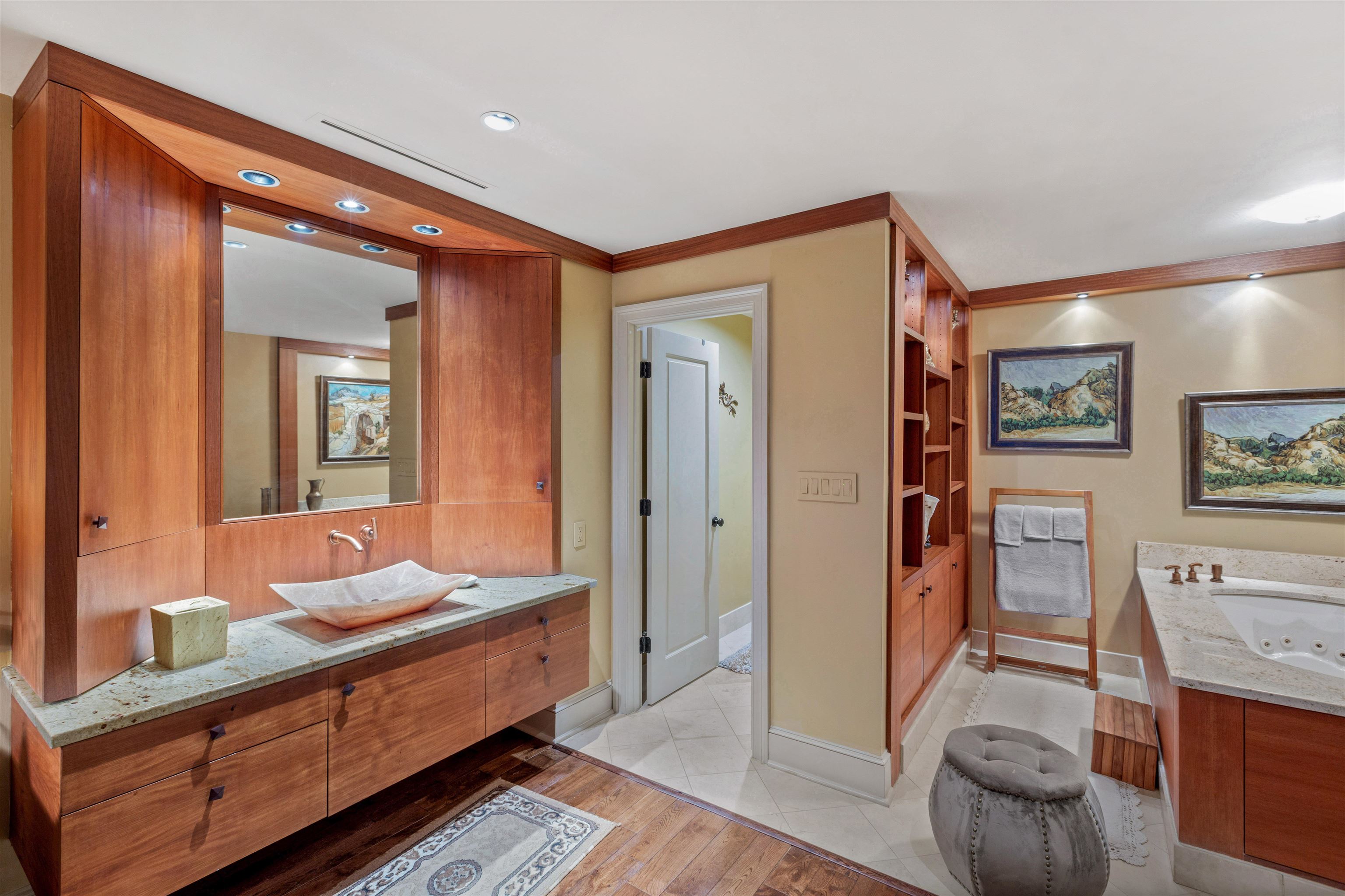 655 Riverside Drive, Unit 1208 Memphis, TN 38103 - Photo 24 of 29 Bathroom featuring vanity, a jetted tub, light wood-type flooring, crown molding, and built in shelves