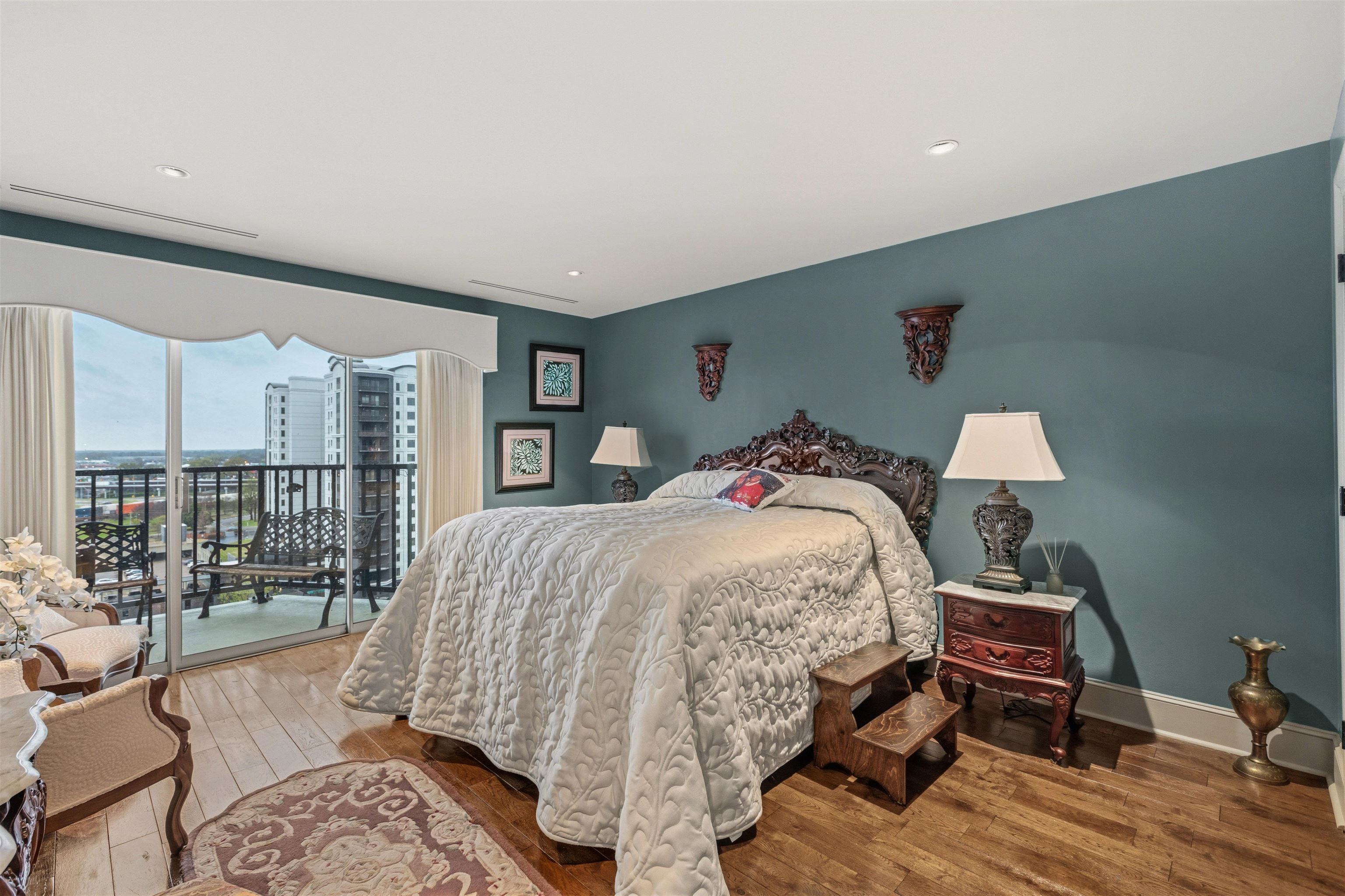 655 Riverside Drive, Unit 1208 Memphis, TN 38103 - Photo 26 of 29 Bedroom with access to exterior and wood-type flooring