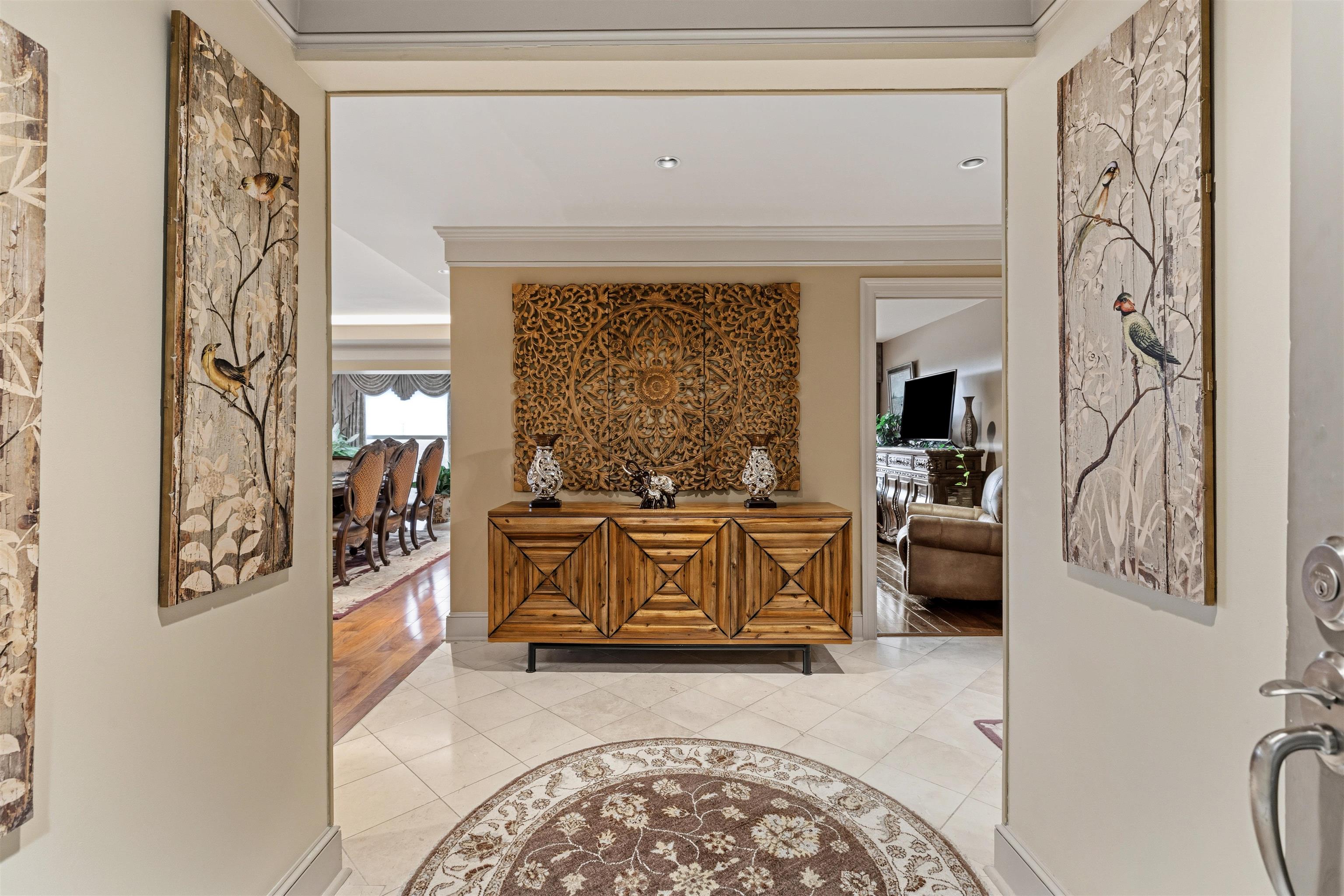 655 Riverside Drive, Unit 1208 Memphis, TN 38103 - Photo 5 of 29 Hallway featuring light tile patterned flooring and crown molding