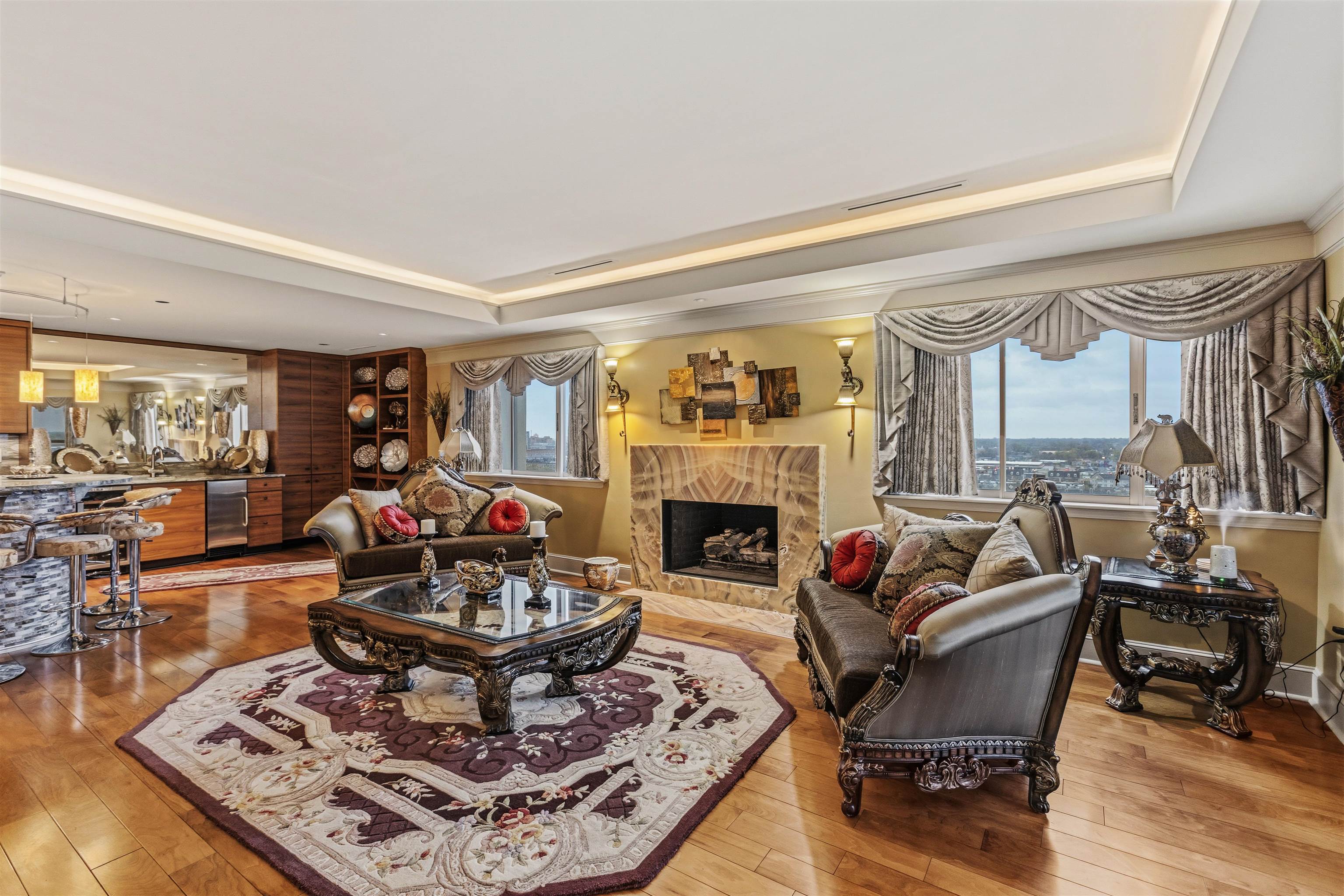 655 Riverside Drive, Unit 1208 Memphis, TN 38103 - Photo 7 of 29 Living room with light wood-style floors and a premium fireplace