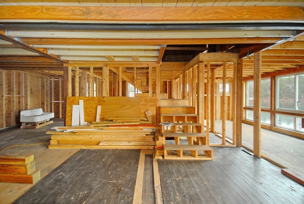 66 Pine Point Road Stow, MA 01775 - Photo 11 of 25 a view of a patio with table and chairs