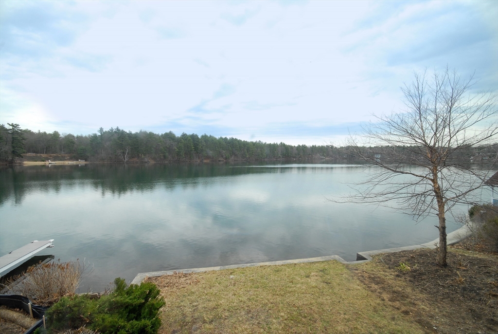 66 Pine Point Road Stow, MA 01775 - Photo 18 of 25 a view of a lake in between two chairs