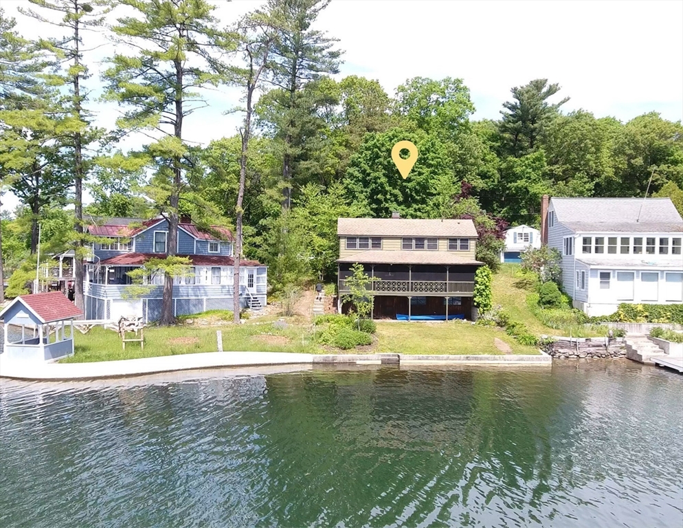 66 Pine Point Road Stow, MA 01775 - Photo 23 of 25 a view of house with outdoor space swimming pool and lake view