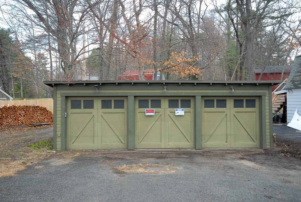 66 Pine Point Road Stow, MA 01775 - Photo 24 of 25 a front view of a house with a garage