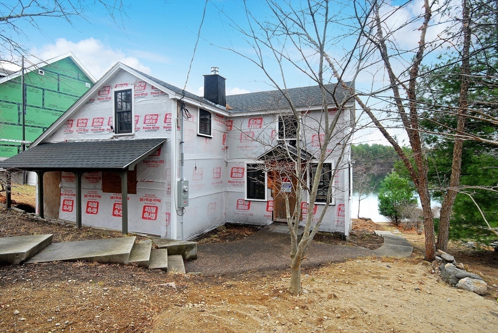 66 Pine Point Road Stow, MA 01775 - Photo 5 of 25 a front view of a house