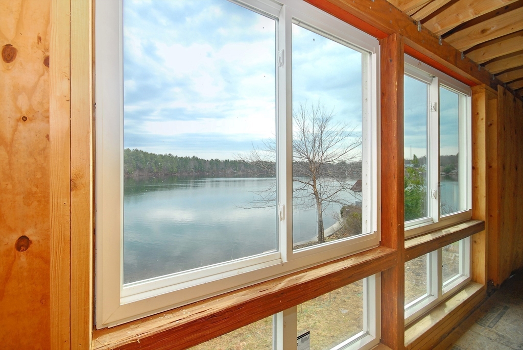 66 Pine Point Road Stow, MA 01775 - Photo 7 of 25 a view of a glass door and a window