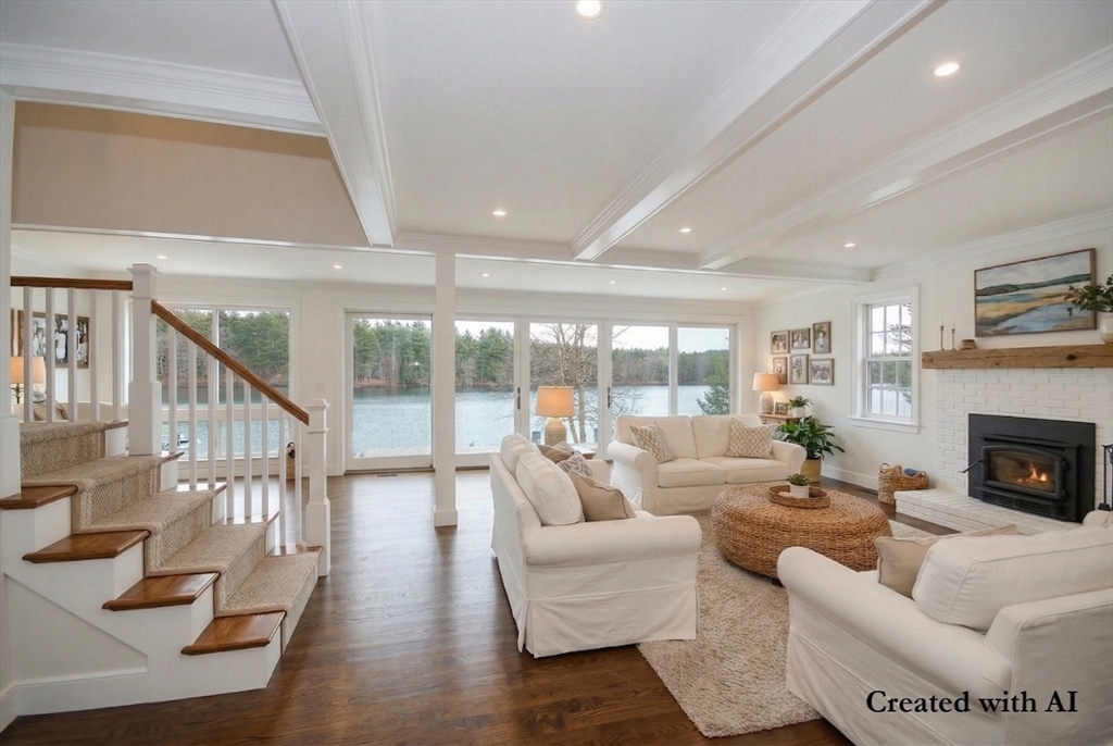 66 Pine Point Road Stow, MA 01775 - Photo 8 of 25 a living room with furniture and a fireplace