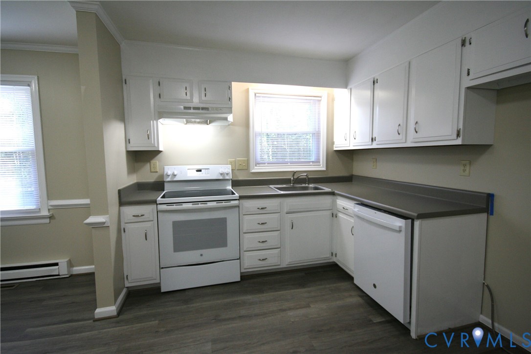 12141 Old Buckingham Road Midlothian, VA 23113 - Photo 32 of 39 Kitchen featuring white cabinetry, dark countertop