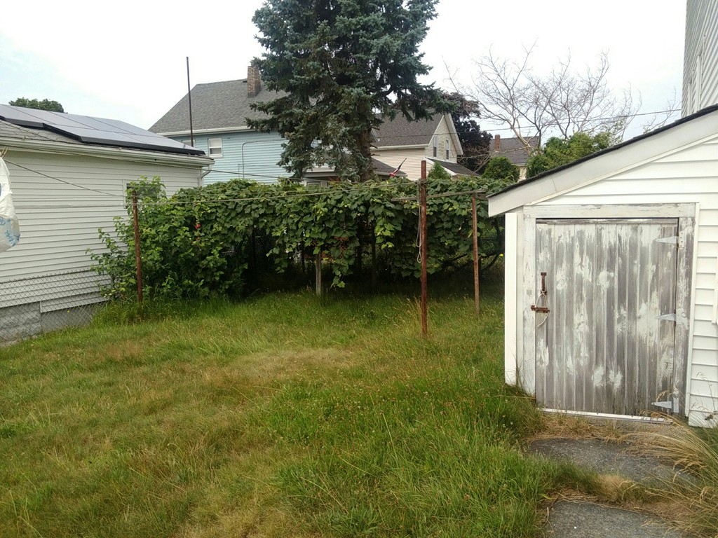 269 Baird Street Fall River, MA 02721 - Photo 10 of 10 a backyard of a house with lots of green space