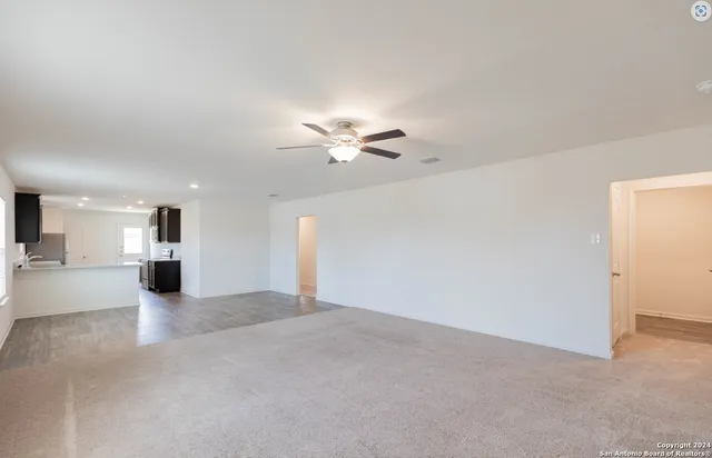 a view of a livingroom with a ceiling fan