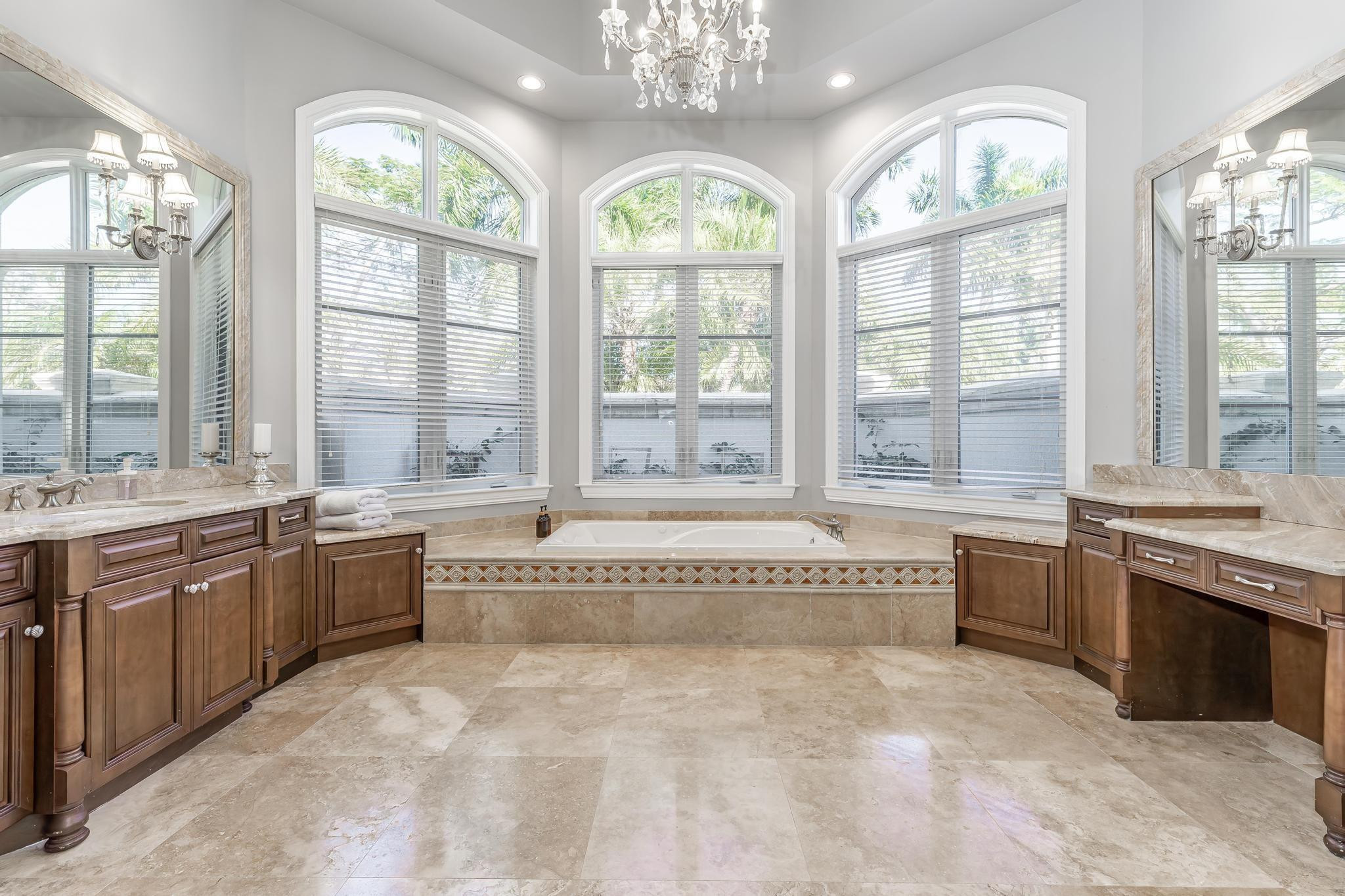 3111 Lake Ridge Lane Weston, FL 33332 - Photo 12 of 21 a large spacious bathroom with a granite countertop tub a sink and a large window