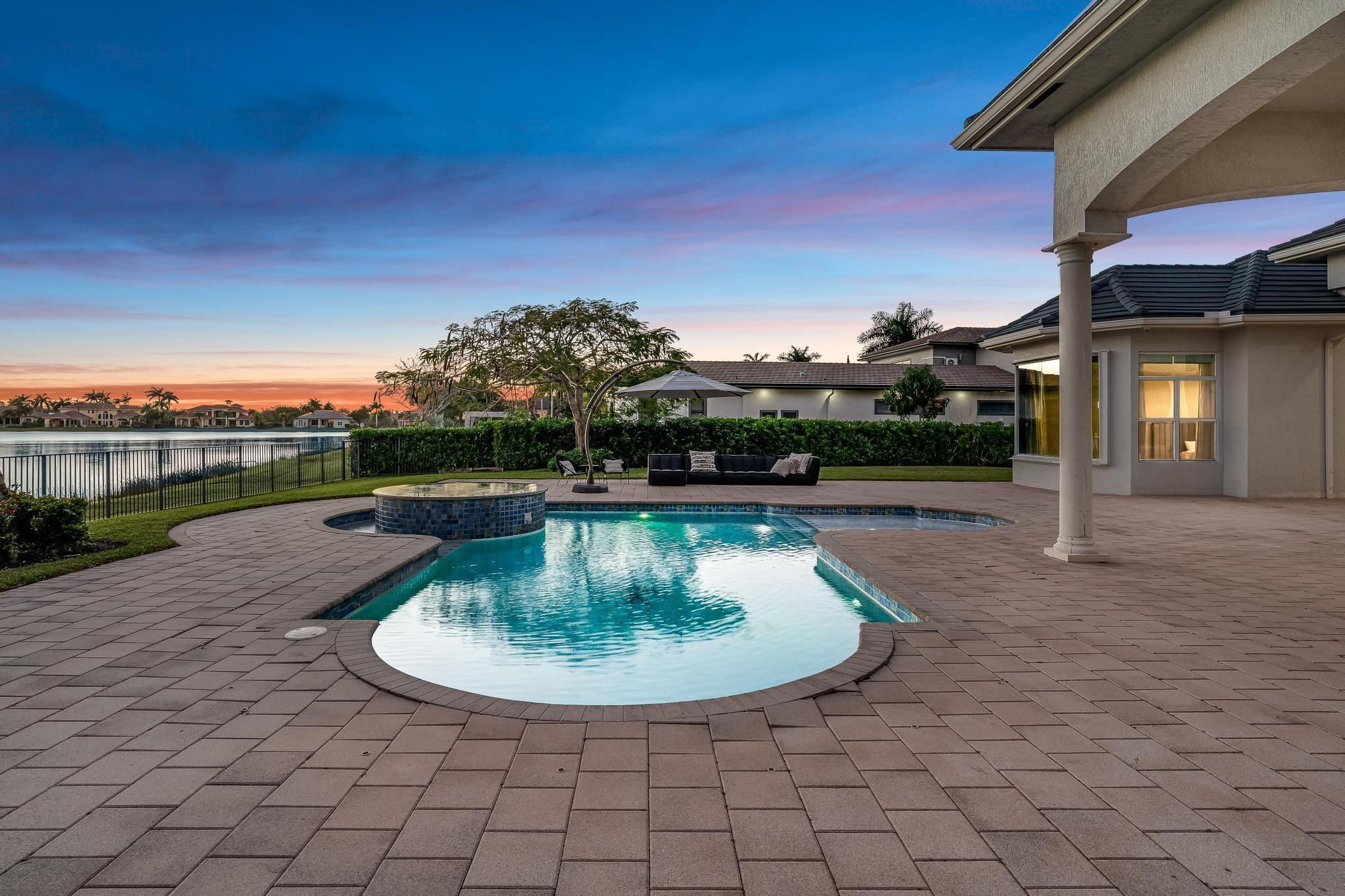 3111 Lake Ridge Lane Weston, FL 33332 - Photo 19 of 21 a view of a swimming pool with a yard