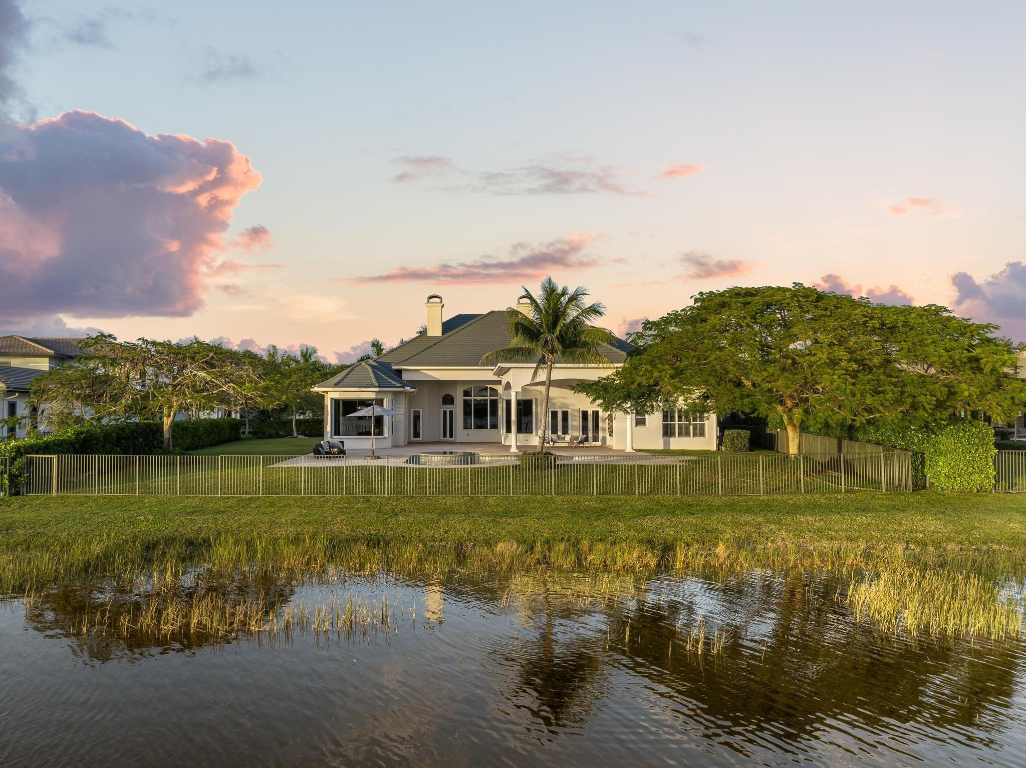 3111 Lake Ridge Lane Weston, FL 33332 - Photo 3 of 21 a view of a lake with a big yard