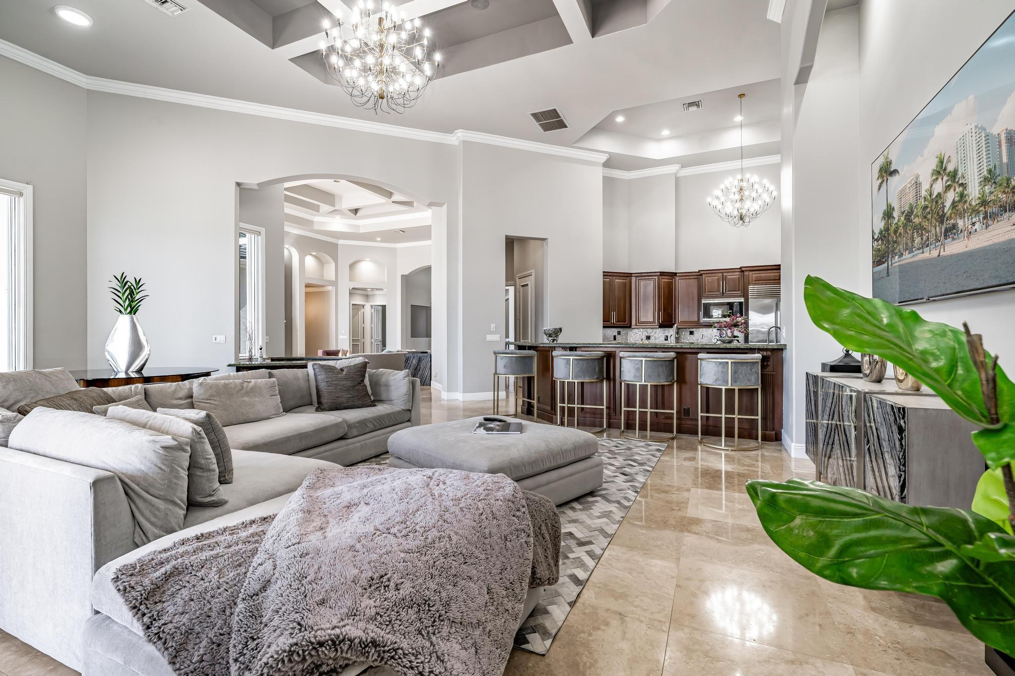 3111 Lake Ridge Lane Weston, FL 33332 - Photo 8 of 21 a living room with furniture a chandelier and a chandelier