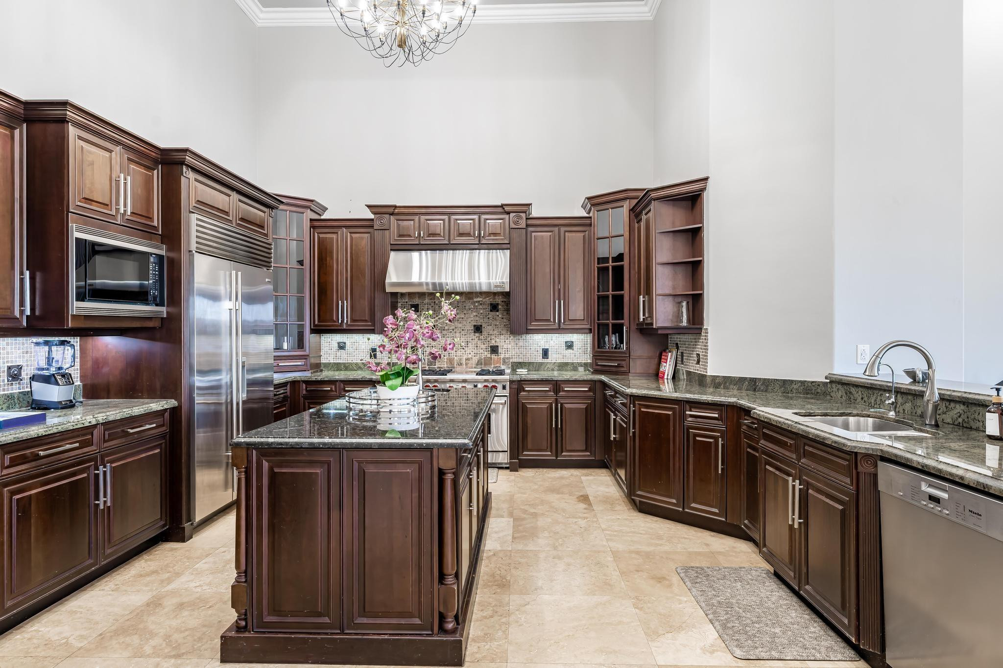 3111 Lake Ridge Lane Weston, FL 33332 - Photo 10 of 21 a kitchen with stainless steel appliances granite countertop a sink stove and refrigerator